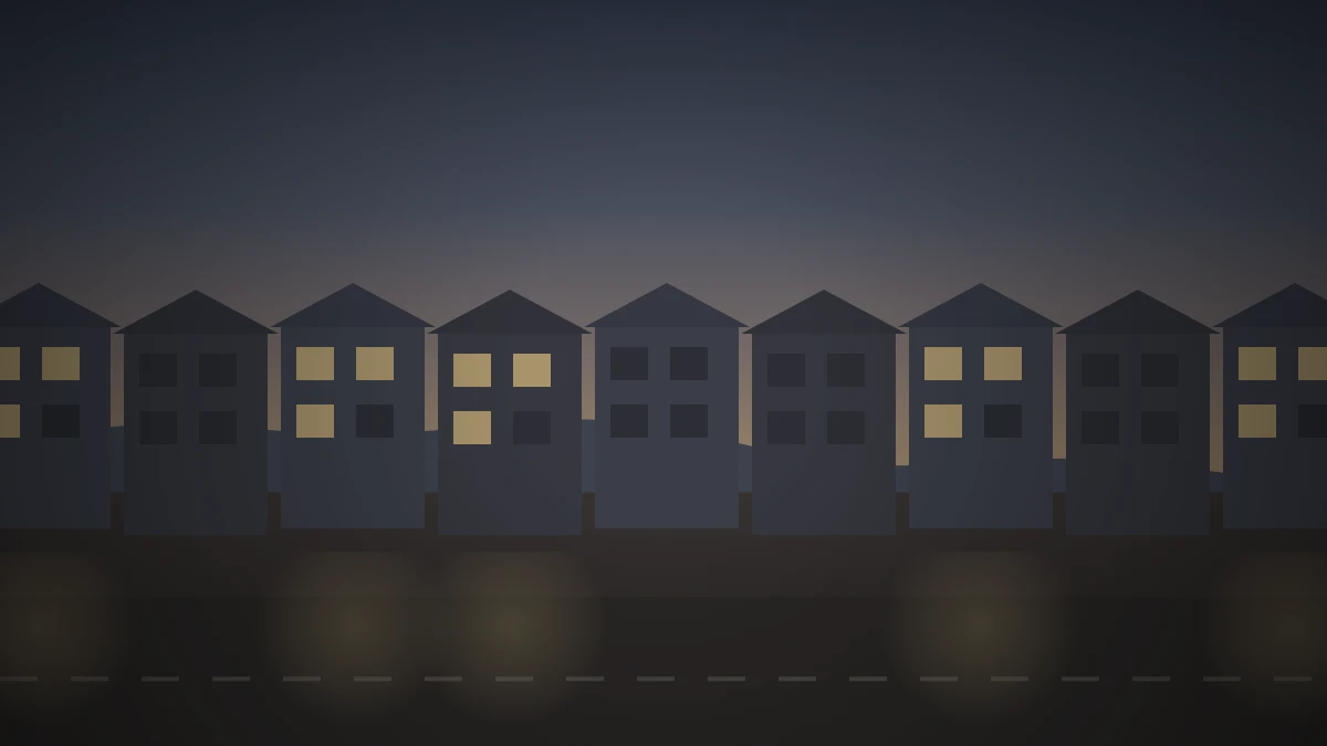 夕暮れの住宅街に似た造りの家が並び、いくつかの窓に明かりがついているイメージ