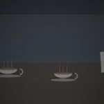 向かい合わせに置かれた二つのカップと、メモが添えられた喫茶店の席