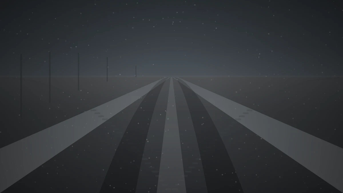 雪が残る冬の道路に轍がついている様子